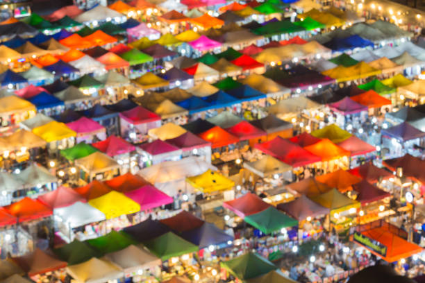 istock Blurred light flea night market colourful night view 867992140