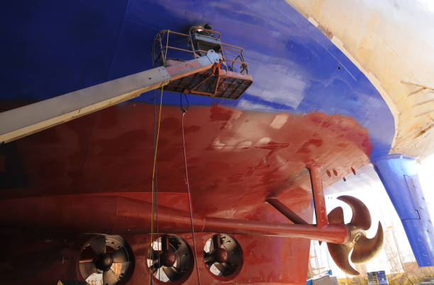 istock Big ship under repairing on floating dry dock in shipyard 867994612