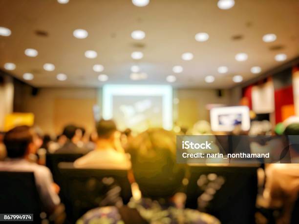 Abstract Blurred Image Of People Sitting In Conference Room For Profession Seminar With Attendee Presenter And Audience Background Business Educaction Concept Official New Product Launches Stock Photo - Download Image Now