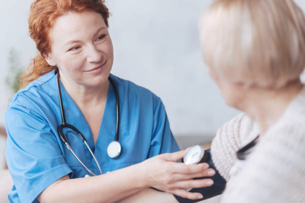 istock Thoughtful medical worker measuring blood pressure 868000970