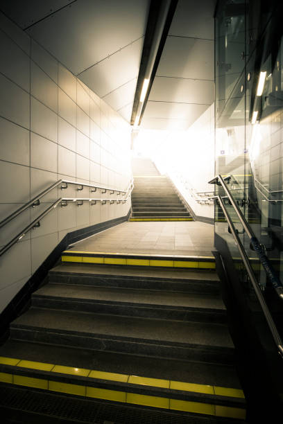 istock Underground passage with stairs  going up the light. 868001210