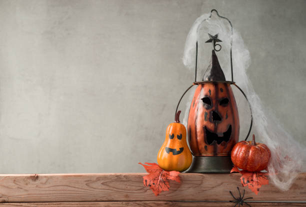 istock Halloween background with decor jack o lantern and wooden board 868001830