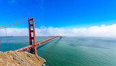 Golden Gate Bridge in clouds on a beautiful summer day  - Panoramic view from Battery Spencer -  California, USA