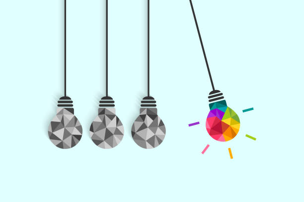 Newton's cradle pendulum concept with lightbulbs Newton's cradle pendulum with hanging light bulbs as idea and creativity concept. Colorful bulb among plain grey ones. perpetual motion stock illustrations