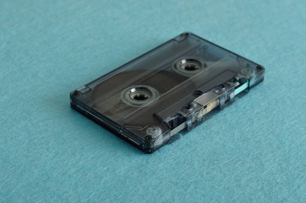 istock An old tape cassette isolated on a blue background 868019042
