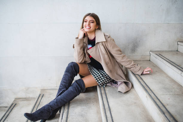 istock Woman sitting on the stairs and posing 868019606