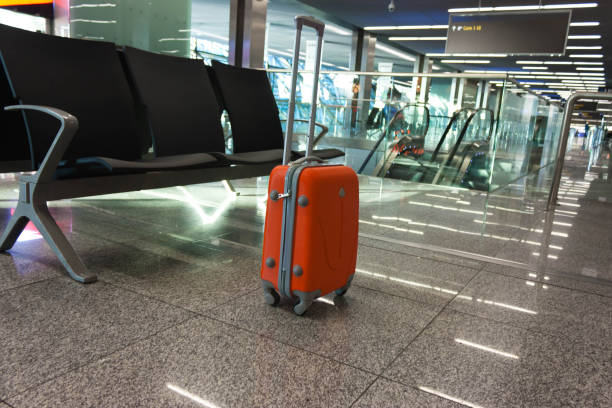 istock Orange suitcase in the waiting room 868019646