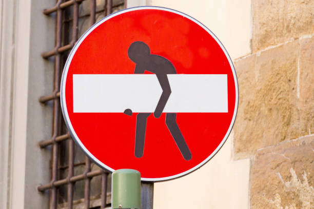 Footpath Sign to Palazzo Pitti at Florence in Tuscany, Italy, with a sticker visible.