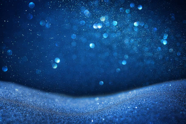 istock glitter vintage lights background. blue and black. de focused 868029338