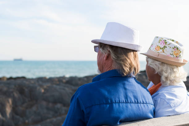 istock Senior couple sitting on a bench 868033014