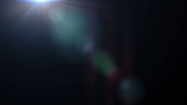 istock blue and mainly off screen lens flare effect overlay texture with bokeh in front of a black background 868038556