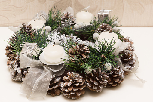 Christmas wreath of fir twigs with candles