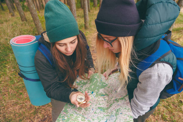 istock two young tourist determine the route map and compass 868043674