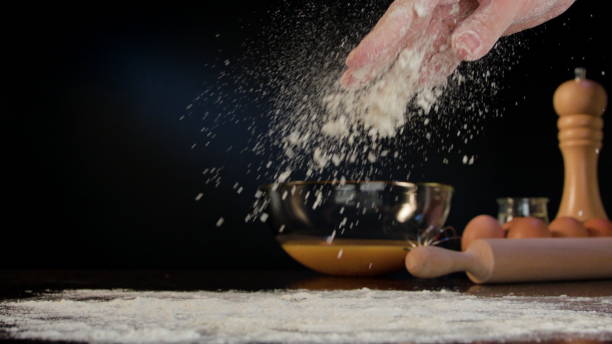 istock Female Hand Spilling Flour on the Table 868044038