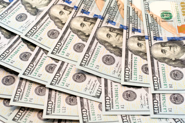 istock dollars lie in a fan 868048380
