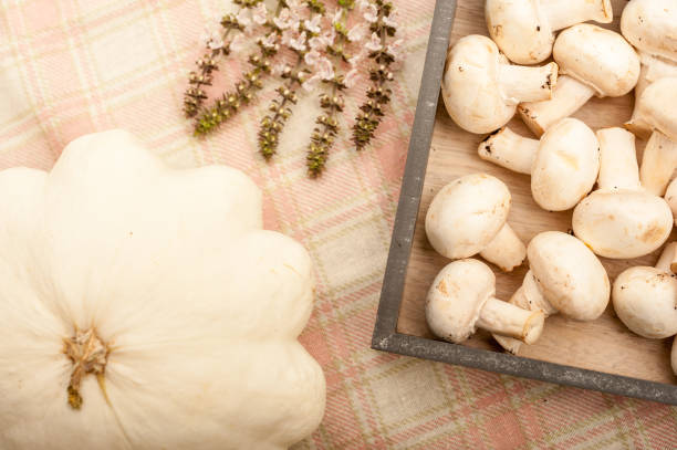 istock Mushrooms, Pumpkin and Basil Flowers on a Table 868048658