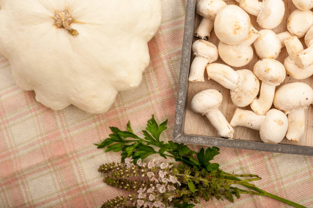 istock Mushrooms, Pumpkin, Parsley and Basil Flowers on a Table 868048676