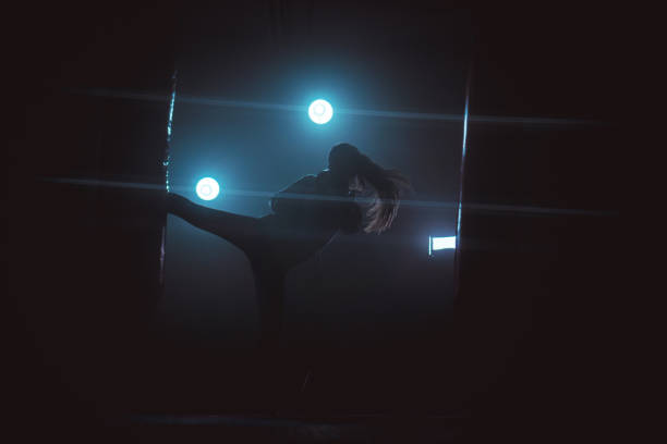 istock Energetic woman kickboxing 868048894