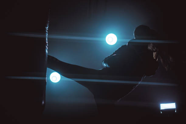 istock Energetic woman kickboxing 868048898