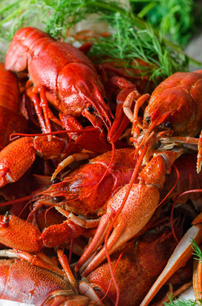 istock Boiled crawfish with dill in wooden dish 868052152