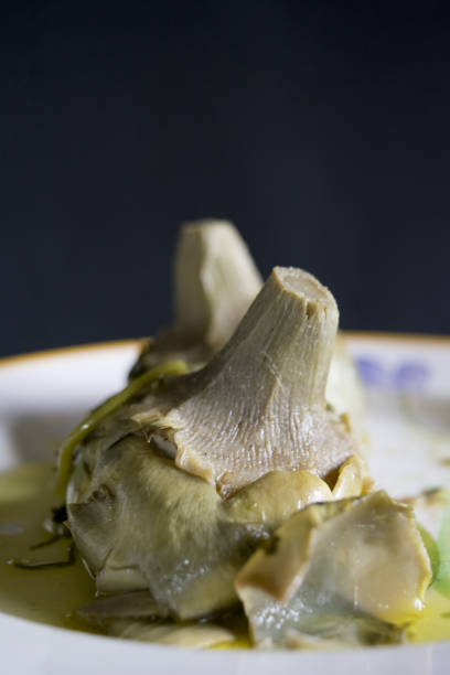 roman style artichokes in a white dish