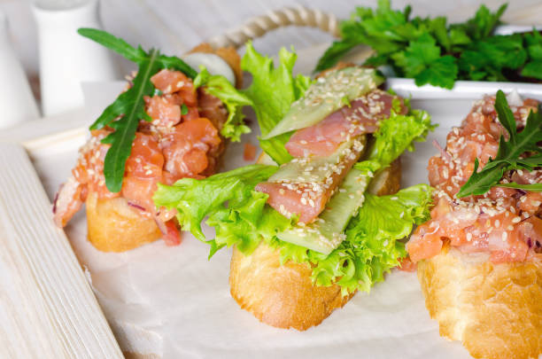 istock Sandwich with salmon served with fresh salad and sesame 868053902
