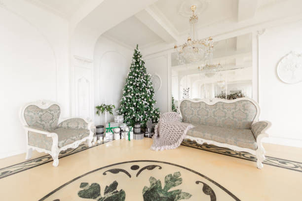 istock Christmas morning. classic apartments with a white fireplace, decorated tree, bright sofa, large windows 868054332