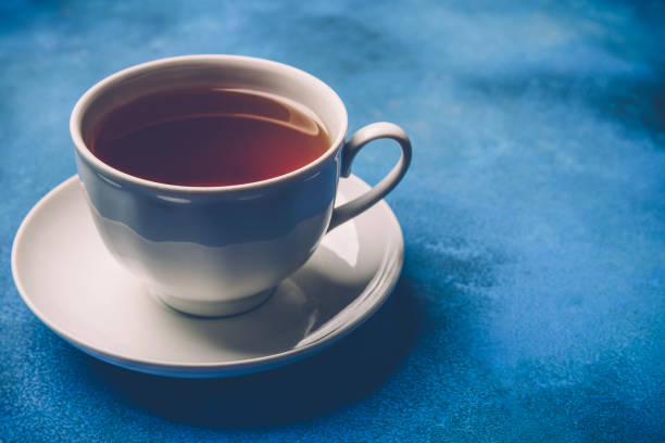 istock Cup of tea on a blue background 868054430