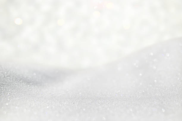 istock glitter vintage lights background. silver and white. de-focused 868054650