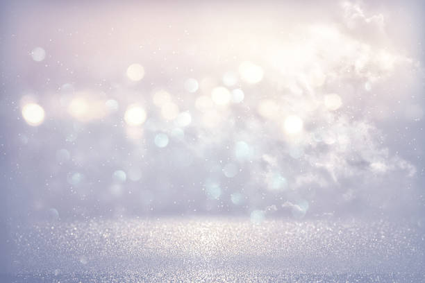 istock glitter vintage lights background. light blue and silver. de focused 868054652