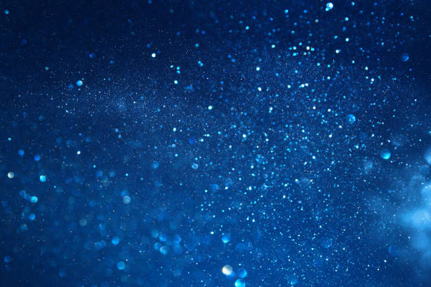 istock blue glitter vintage lights background. defocused 868054662