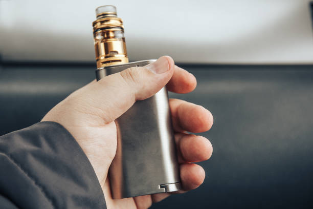 istock Vaping device in the man's hand. Electronic cigarette 868055350
