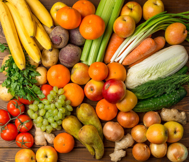 istock Group Fruits and vegetables on a wooden rustic table 868057082