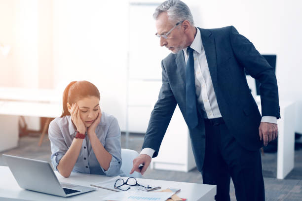 istock Serious chief yelling at female office worker 868057186