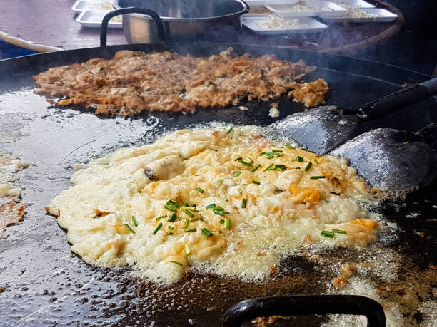 istock Fried mussel pancakes in the large pan 868060146