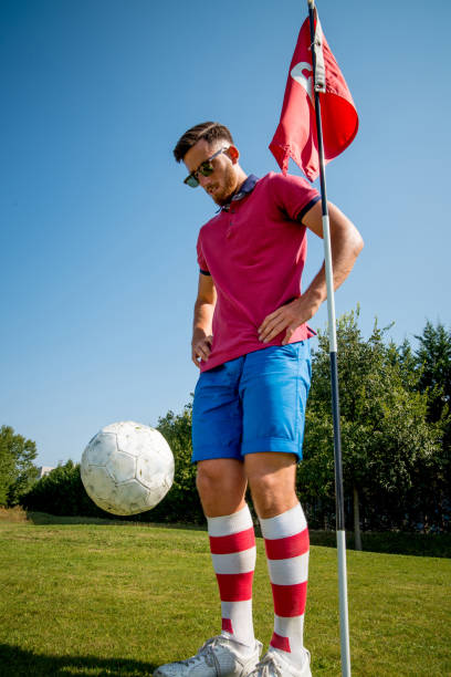 istock Footgolf Player Looking at the Ball in the Air 868061112