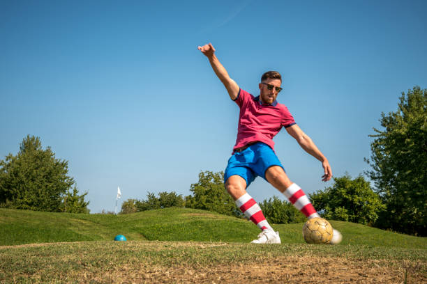 istock Footgolf Player Striking the Ball 868061134