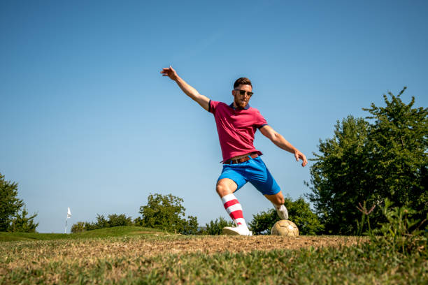 istock Footgolf Player Striking the Ball 868061136
