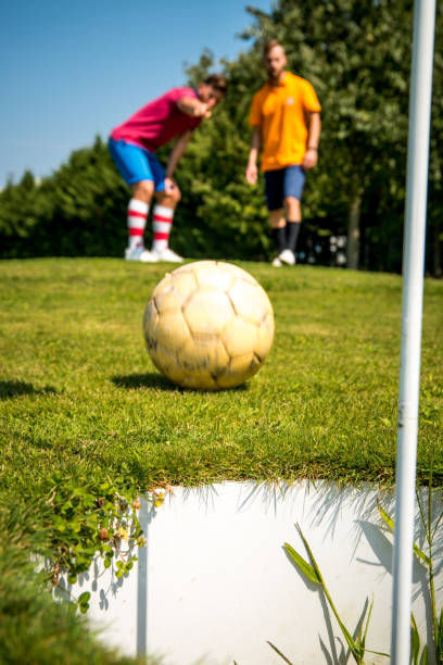 istock Footgolf Players Putting the Ball 868061180