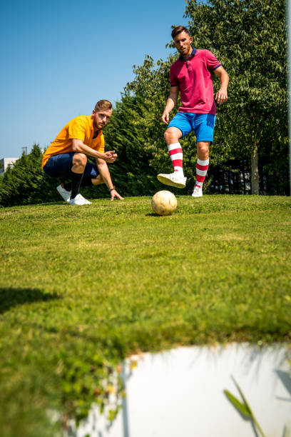 istock Footgolf Players Putting the Ball 868061208