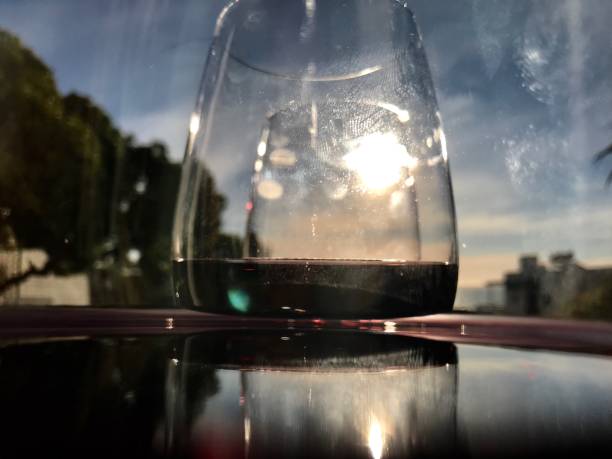 Glasses of red wine with reflection of outdoors
