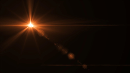 abstract sun burst with digital lens flare light over black background