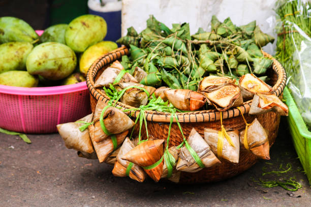 Naem Naem, exotic cambodian streetfood. Cured meat with garlic wrapped in bamboo leaves cambodia food stock pictures, royalty-free photos & images