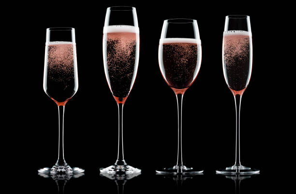 istock Champagne rose glasses with bubbles on black 868071286