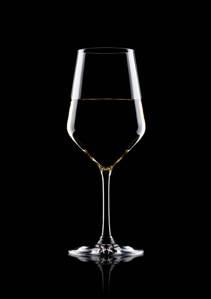 istock Glass of white wine with reflection on black 868071862