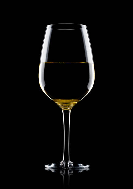istock Glass of white wine with reflection on black 868072288