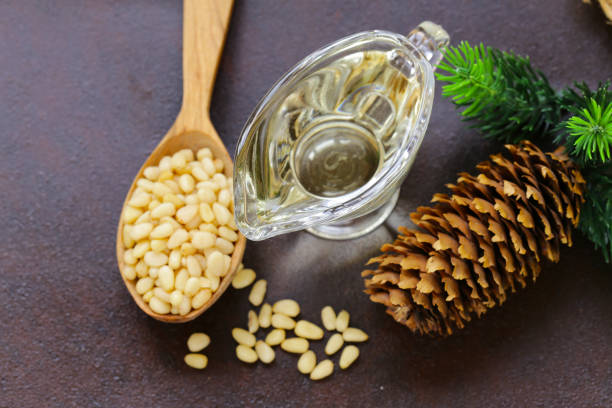 istock Organic vegetable oil from pine nuts on a table 868079200