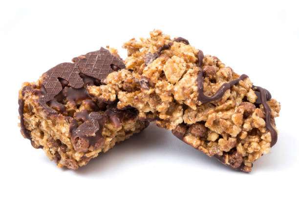 istock Chocolate cereal bars with wheat whole grain and chocolate on a white background. 868079490