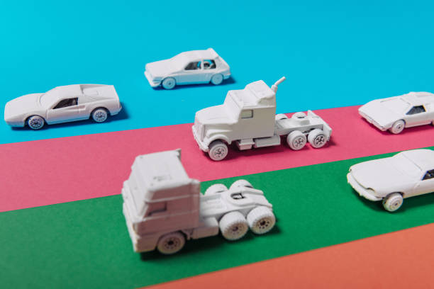 Minimalist pastel color image with white toy cars and vehicles from different perspectives. Color surge and white cars representing traffic, commuting, transportation and modern living. Lots of copy space on image.
