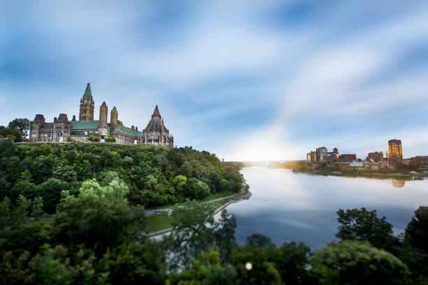 Parliament Hill in Ottawa, Ontario, Canada A landscape of Parliament Hill, Ottawa and Gatineau, Quebec, separated by the Ottawa River. ottawa river stock pictures, royalty-free photos & images